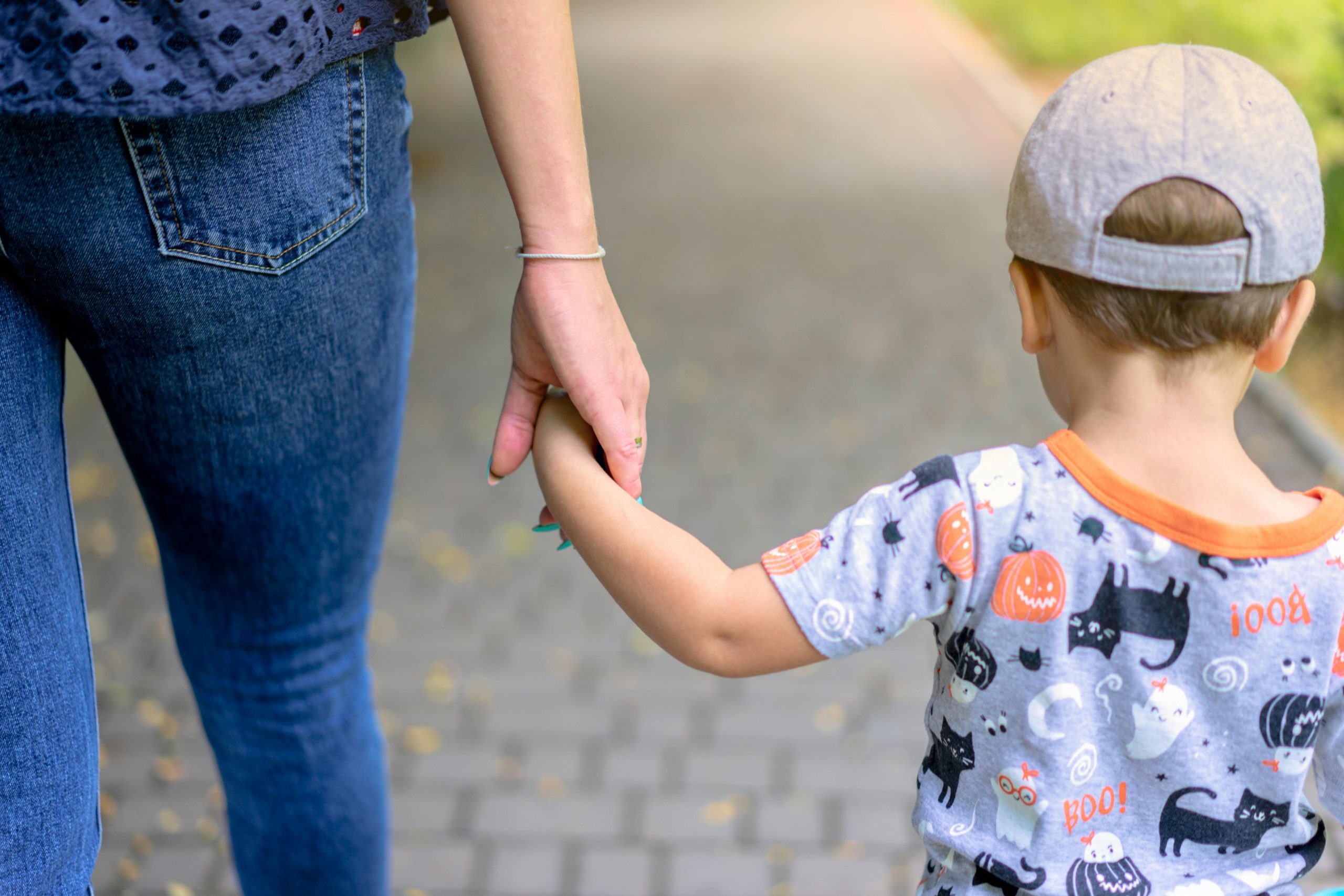 Parent and child holding hands